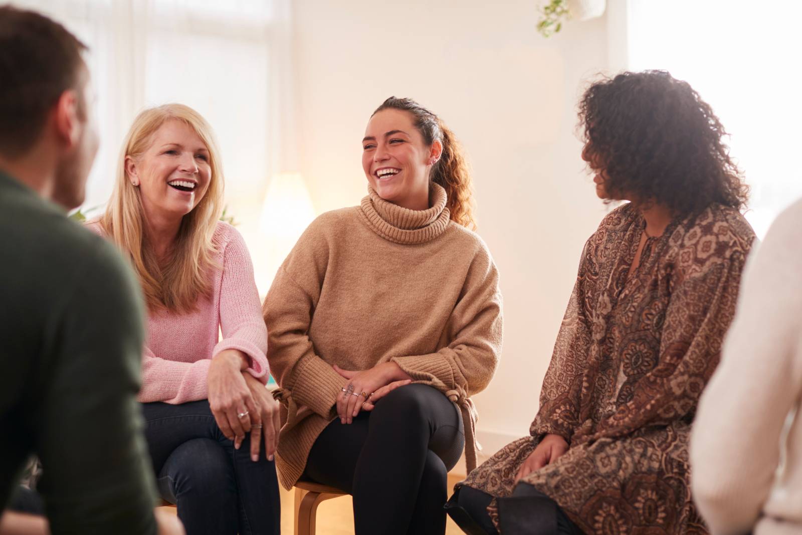 Group of women smiling and talking — lipedema community support